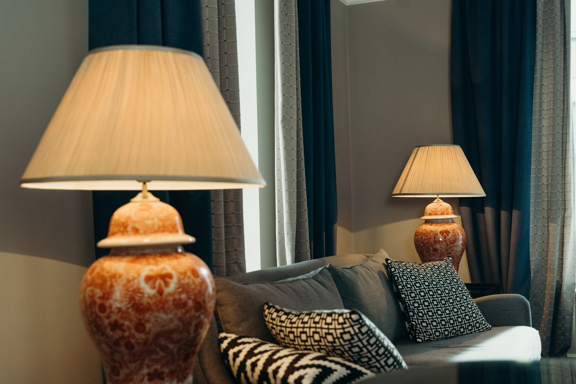 Luxurious living room with elegant ceramic lamps and warm décor